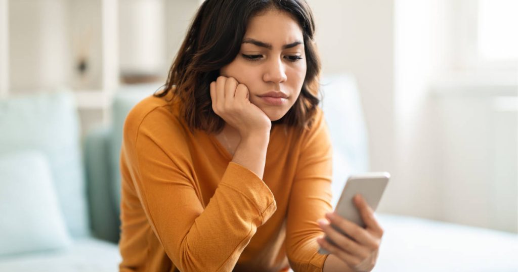 woman looking at phone