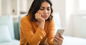 woman looking at phone